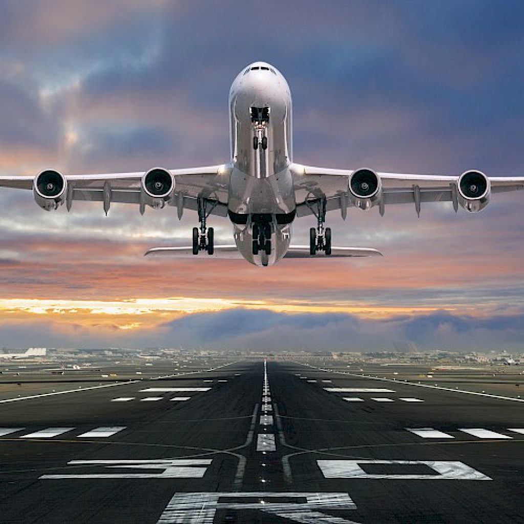 Airplane taking off from the airport, front view.